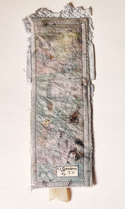 This gorgeous, one-of-a-kind, Catholic bookmark is handmade with repurposed paper, vintage fabrics and an old religious image of Immaculate Mary printed on fabric.