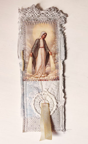This gorgeous, one-of-a-kind, Catholic bookmark is handmade with repurposed paper, vintage fabrics and an old religious image of Immaculate Mary printed on fabric.